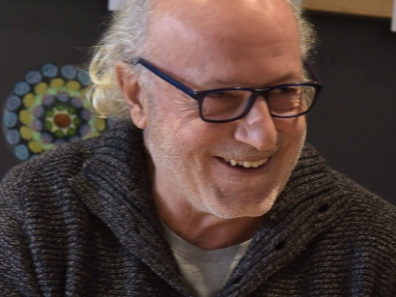 Man wearing glasses and smiling