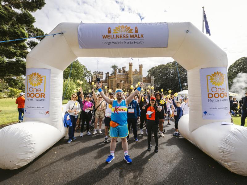 people crossing the finish line at the 2024 wellness walk for mental health in NSW