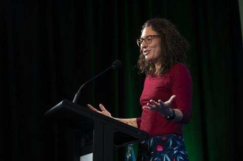 Woman speaking on stage