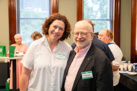 Two people standing together at the One Door Mental Health end of year celebration